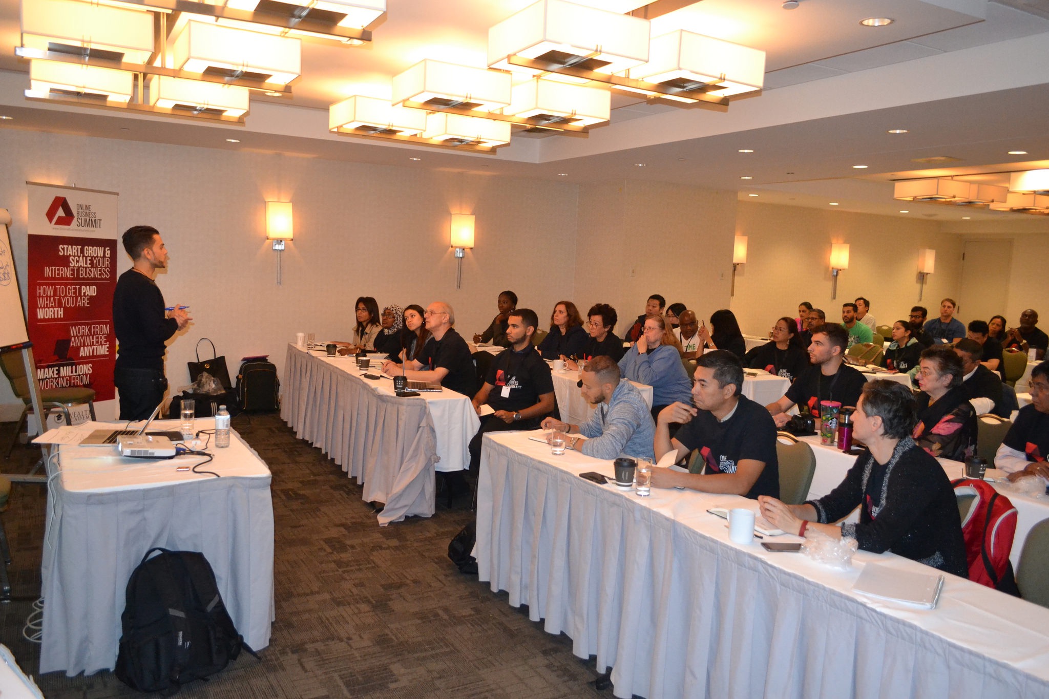 Sean Ali teaching a room of online business learners